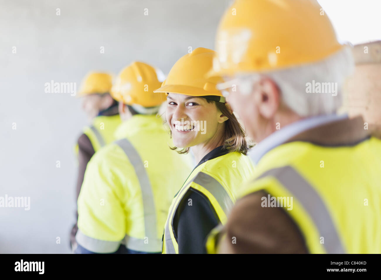 Construction worker smiling on site Stock Photo