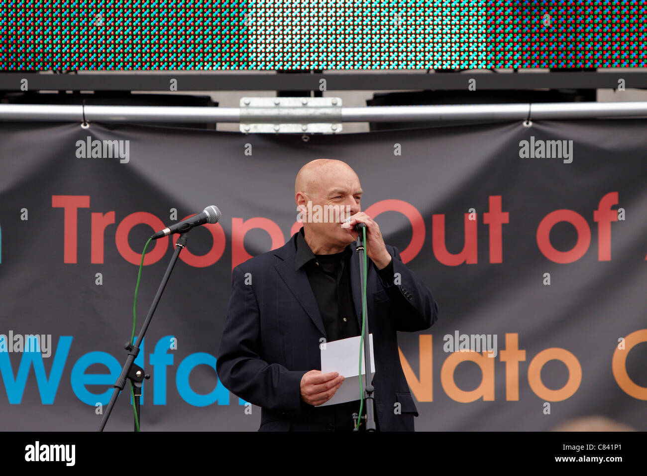 Composer Brian Eno addresses the Anti War Mass Assembly in Trafalgar Square on 10th anniversary of the invasion of Afghanistan Stock Photo