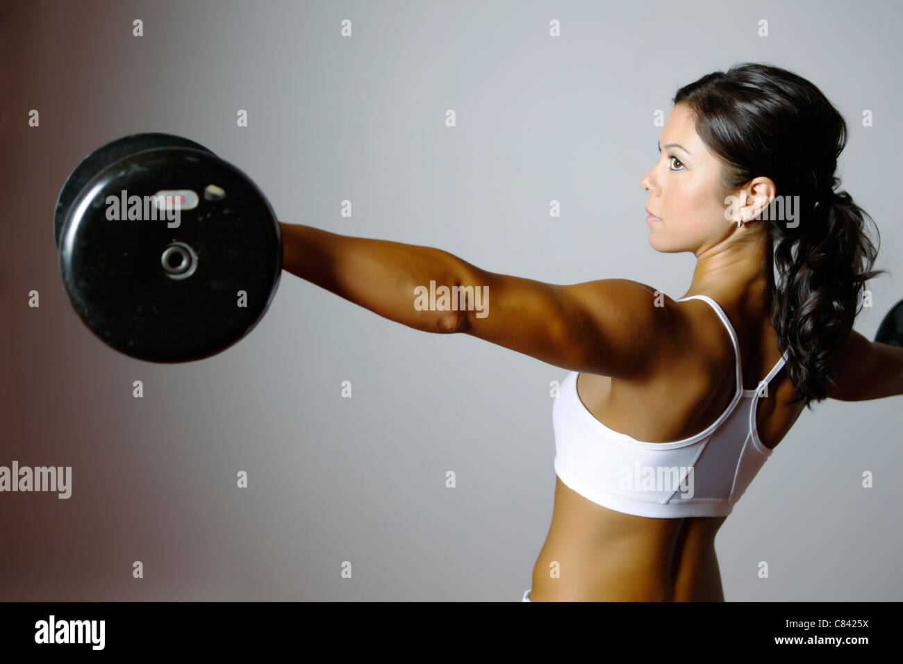 Fit girl exercising in a gym Stock Photo - Alamy