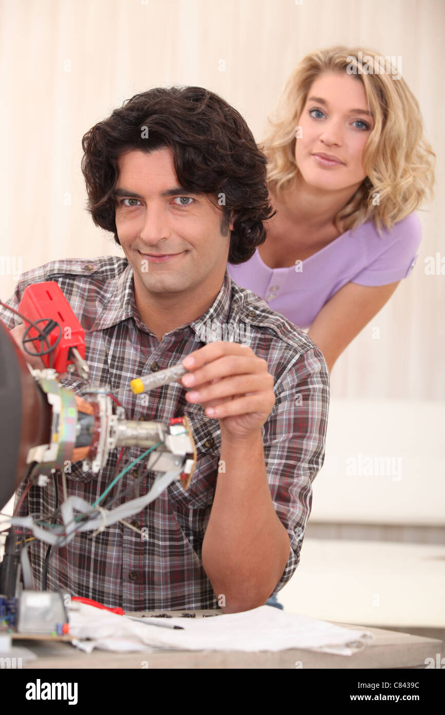 Man fixing an old television Stock Photo Alamy