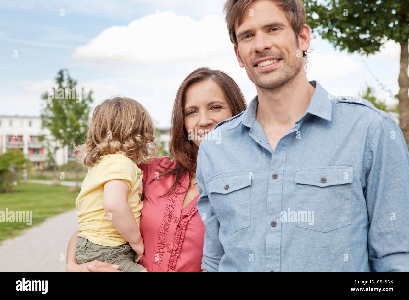 Family standing together outdoors Stock Photo - Alamy