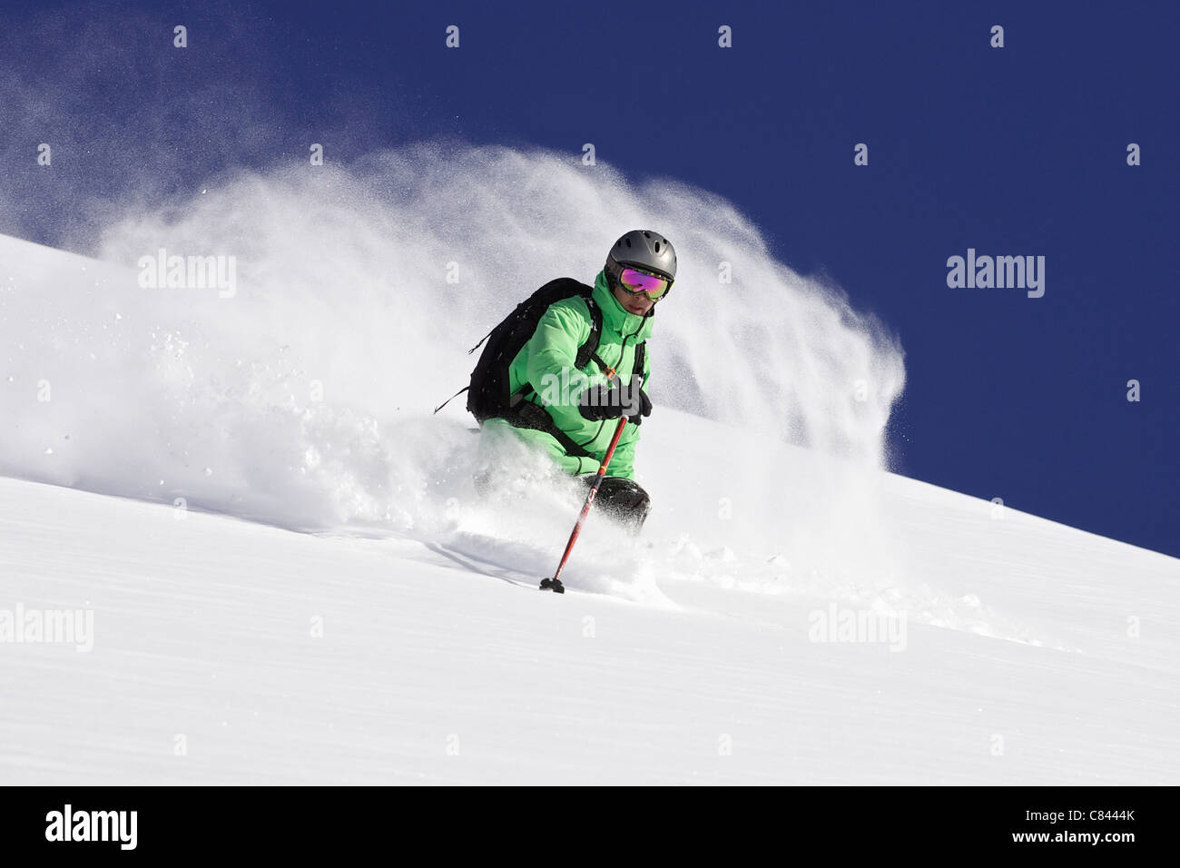 Skier on snowy mountain slope Stock Photo - Alamy