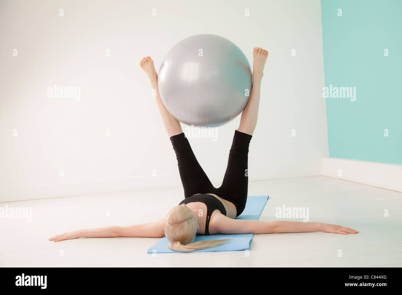 Woman using exercise ball Stock Photo Alamy