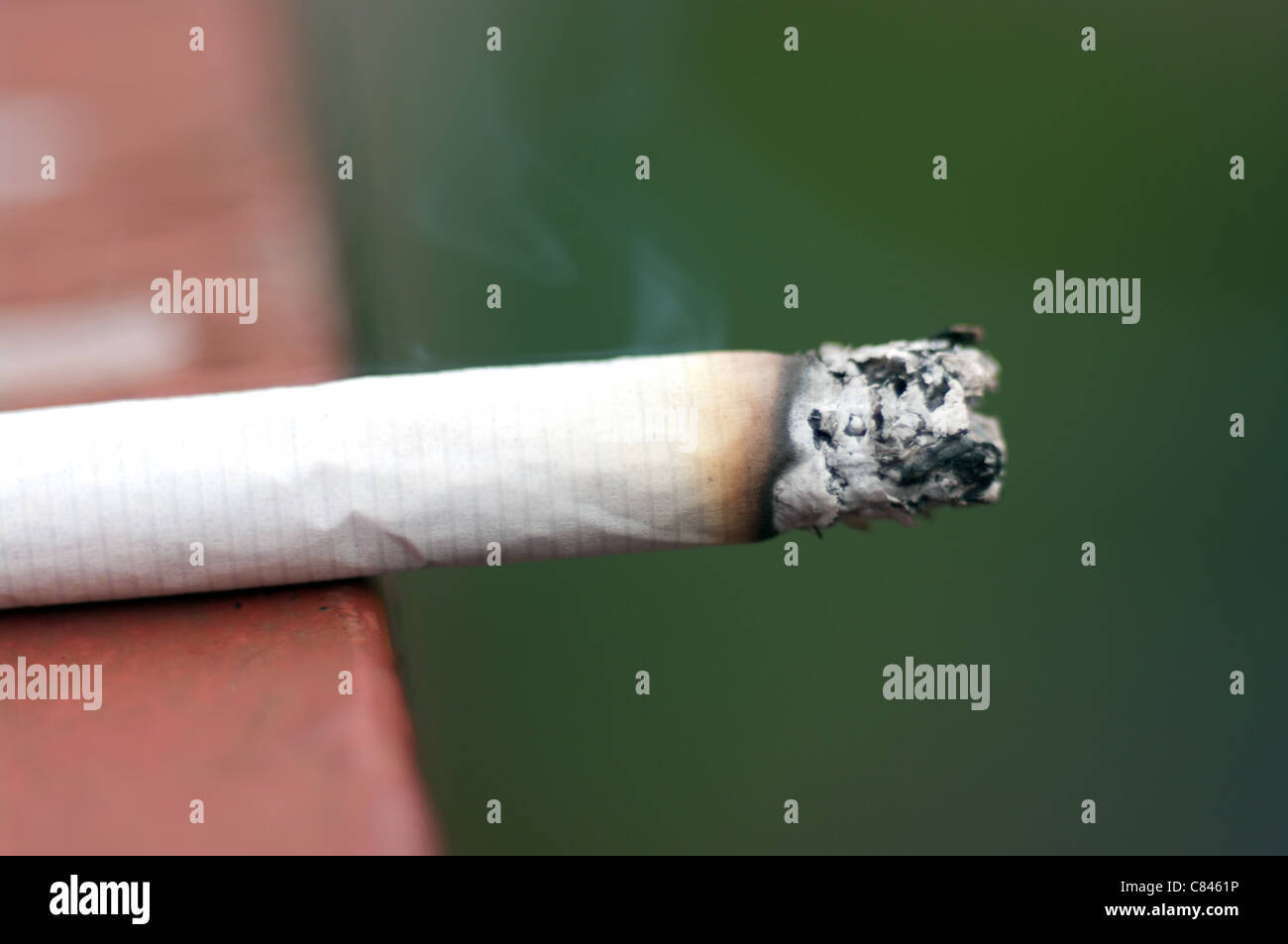 Burning cigarette with smoke during daylight outdoor Stock Photo Alamy