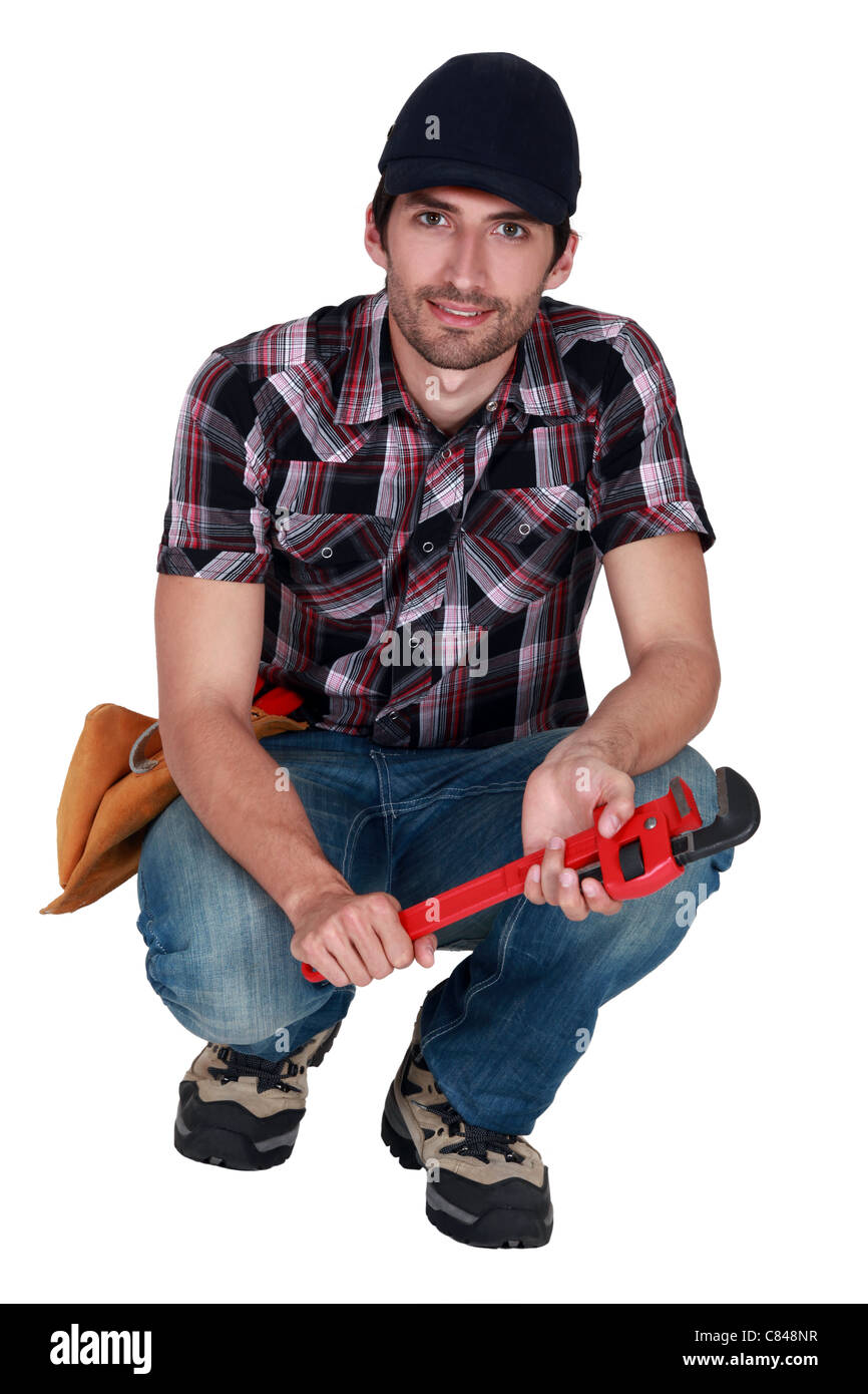 Man holding wrench Stock Photo Alamy