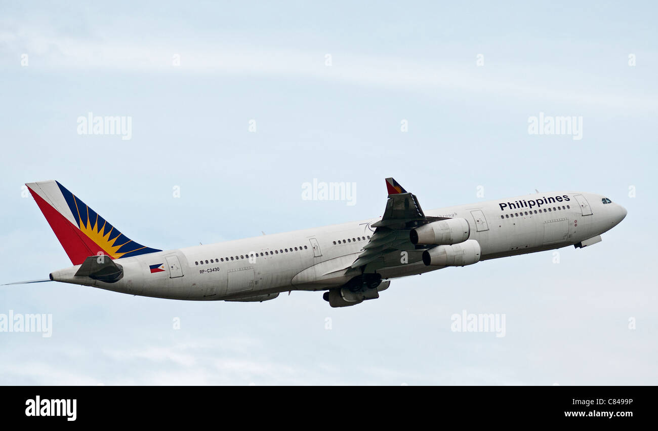 A Philippine Airlines Airbus A340-300 RP-C3430 plane taking takes off  airborne  Vancouver International Airport Canada Stock Photo