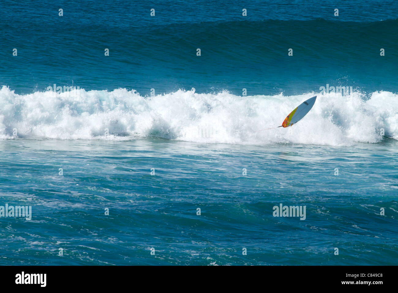 Surf board rider falling off his board in Queensland Australia Stock Photo