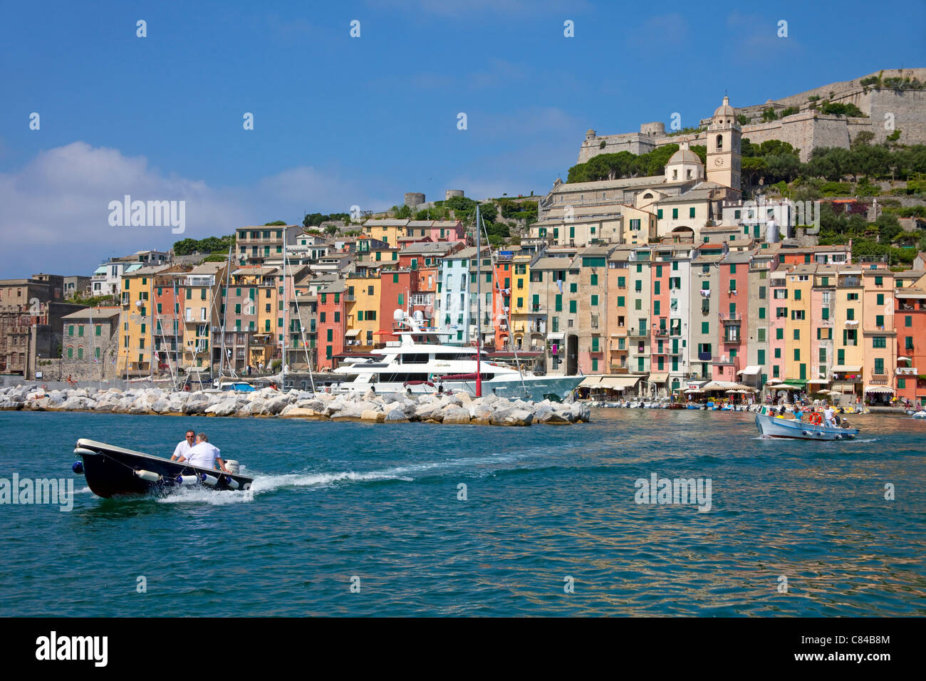 Water taxi to Palmeria island, colourful houses of Porto Venere, province La Spezia, Liguria di Levante, Italy, Mediterranean sea, Europe Stock Photo