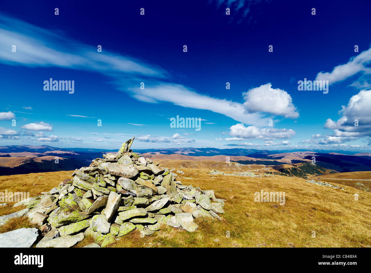Pile of rocks marking the Mohoru peak of Parang mountains in Romania ...