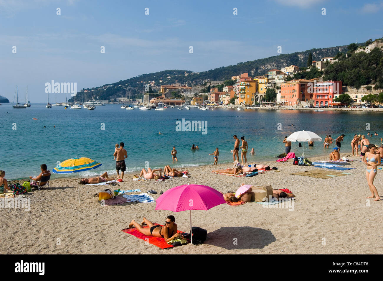 Villefranche sur Mer, the beach and holidaymakers, South of France Stock Photo