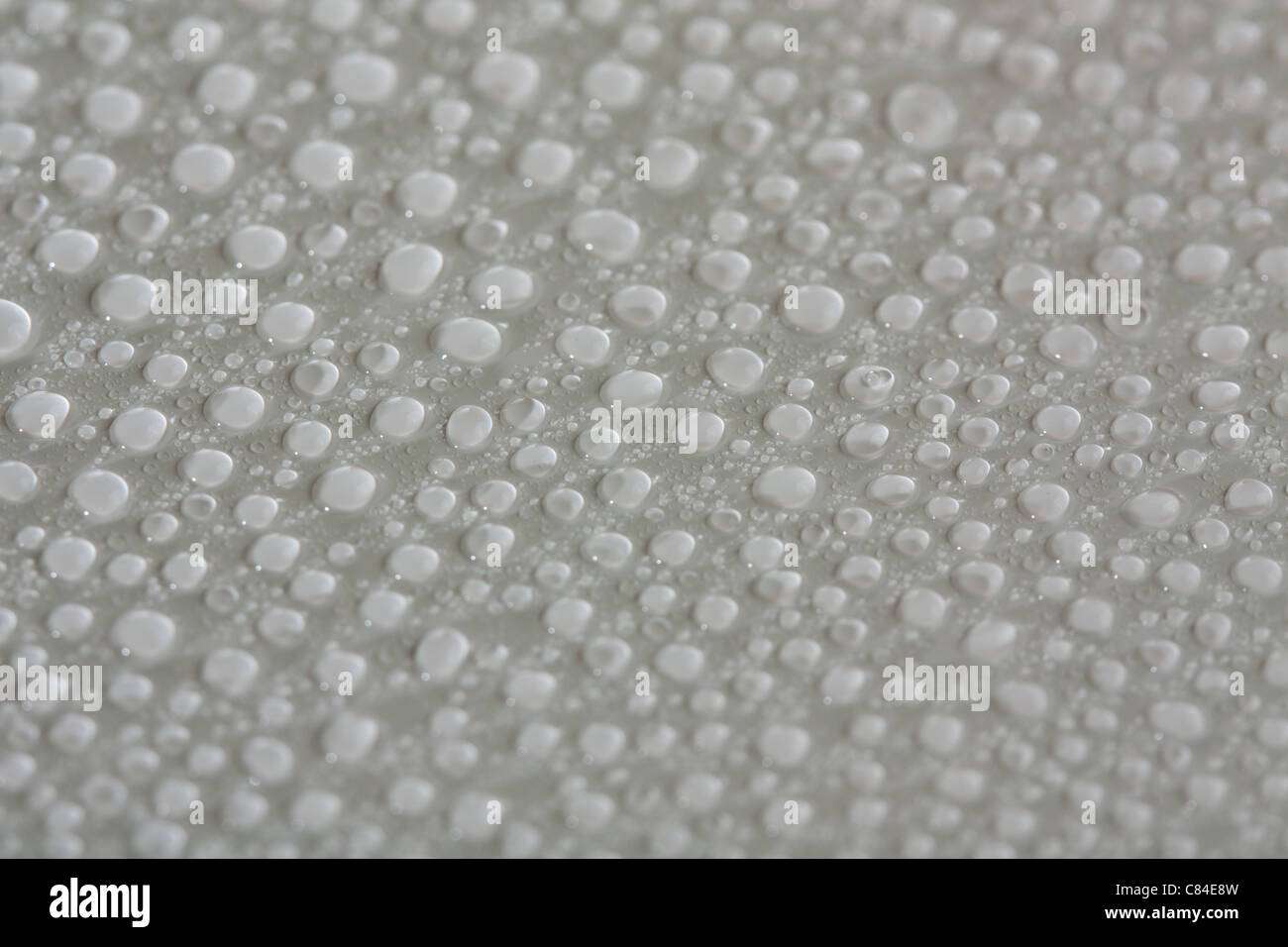 Water drop background on white surface Stock Photo - Alamy