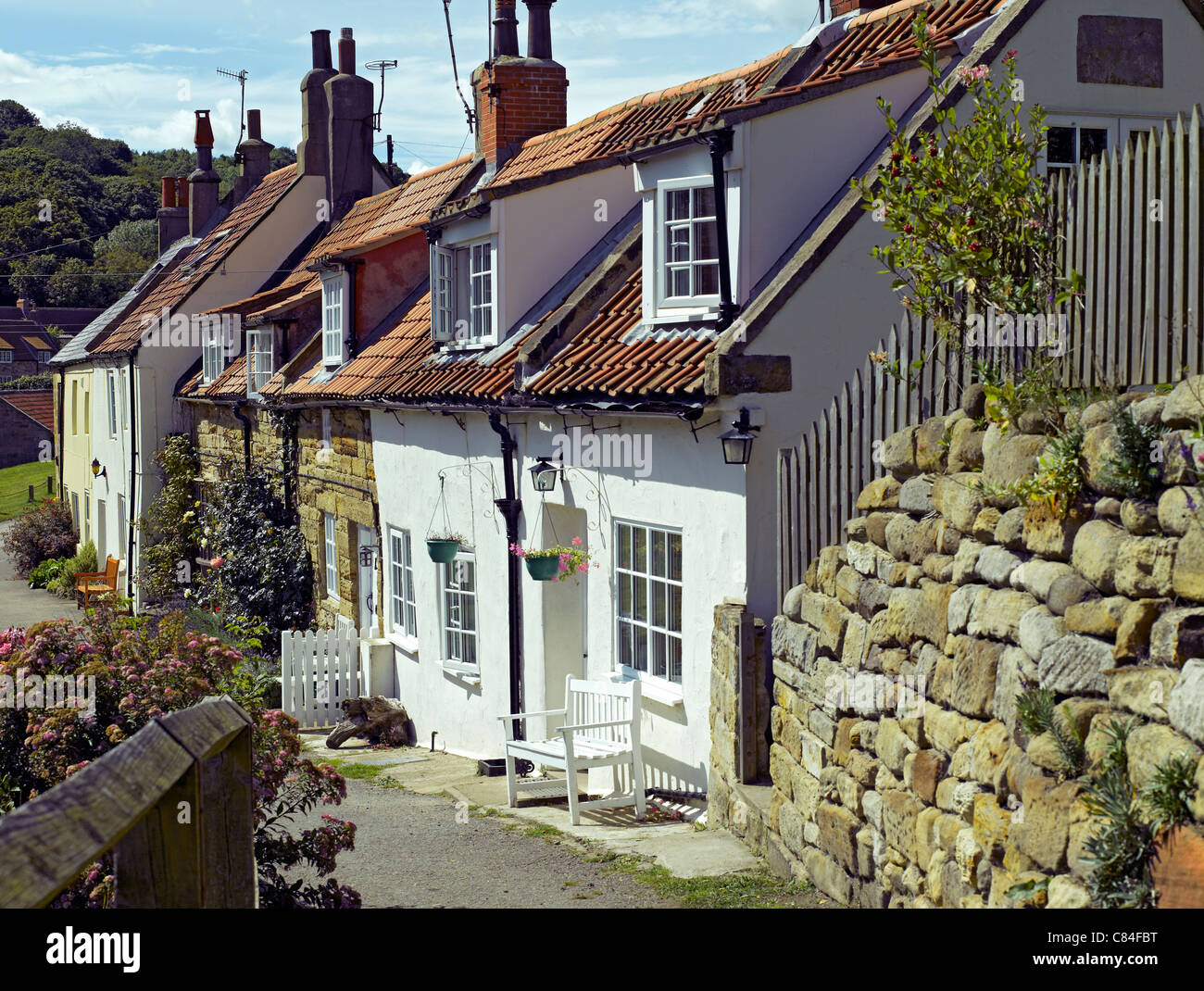 Row of cottages at the seaside village of Sandsend in summer near Whitby North Yorkshire England UK United Kingdom GB Great Britain Stock Photo