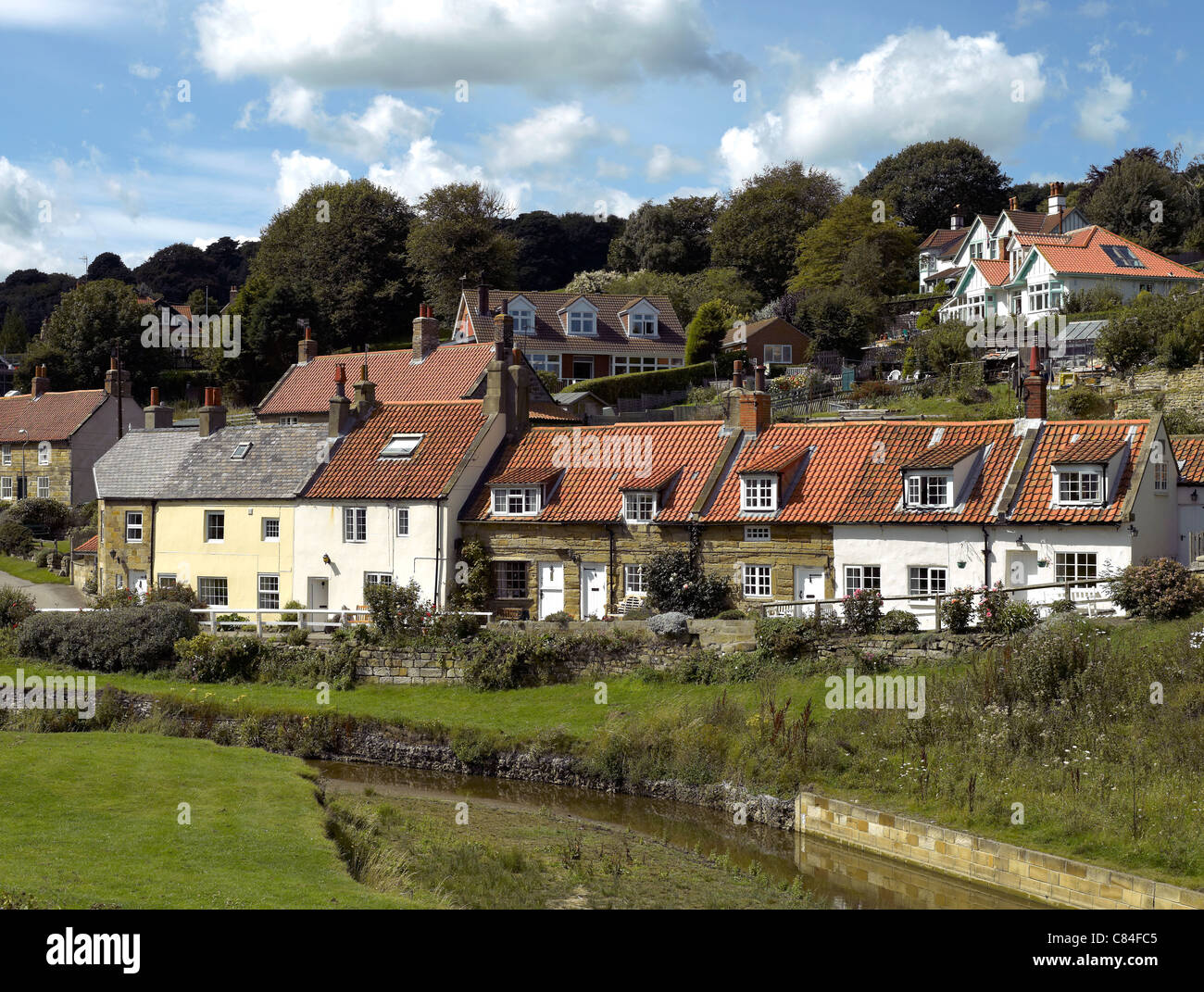 Row of cottages in the seaside village of Sandsend in summer near Whitby North Yorkshire England UK United Kingdom GB Great Britain Stock Photo