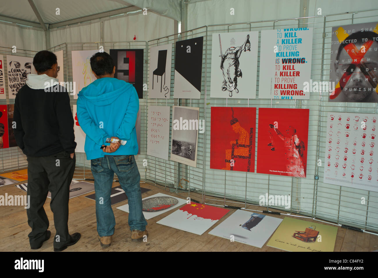 Paris, France. Public Visiting Posters on wall, Public Exhibit outside in a protest against the death penalty. protest art Stock Photo