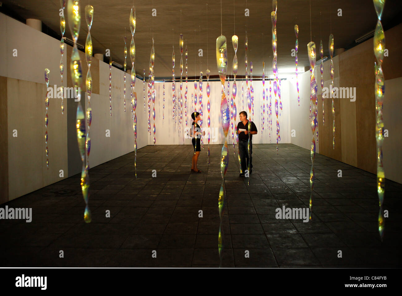 Visitors wander through a contemporary art installation in Herzliya, Israel, on 10 October 2011. The third Herzliya Biennial of Contemporary Art which opened Monday explores the relationship between the political and the aesthetic. Stock Photo