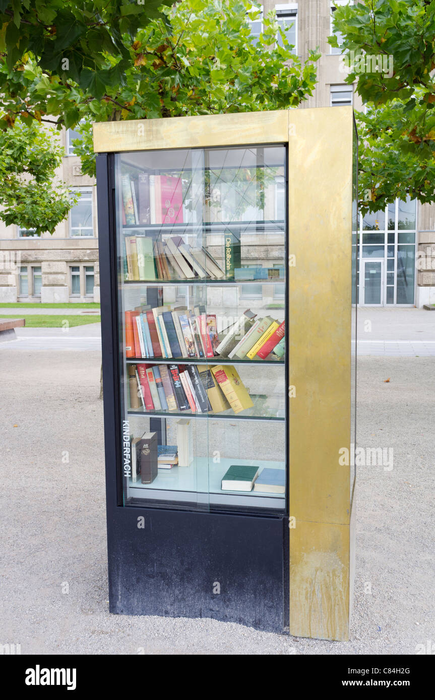 Public Bookcase where people can take and share books on street in Dusseldorf in Germany Stock Photo