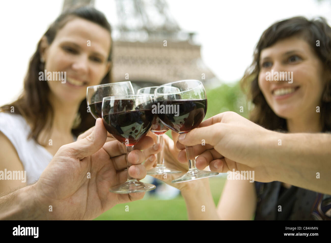 Friends clinking wine glasses outdoors Stock Photo Alamy
