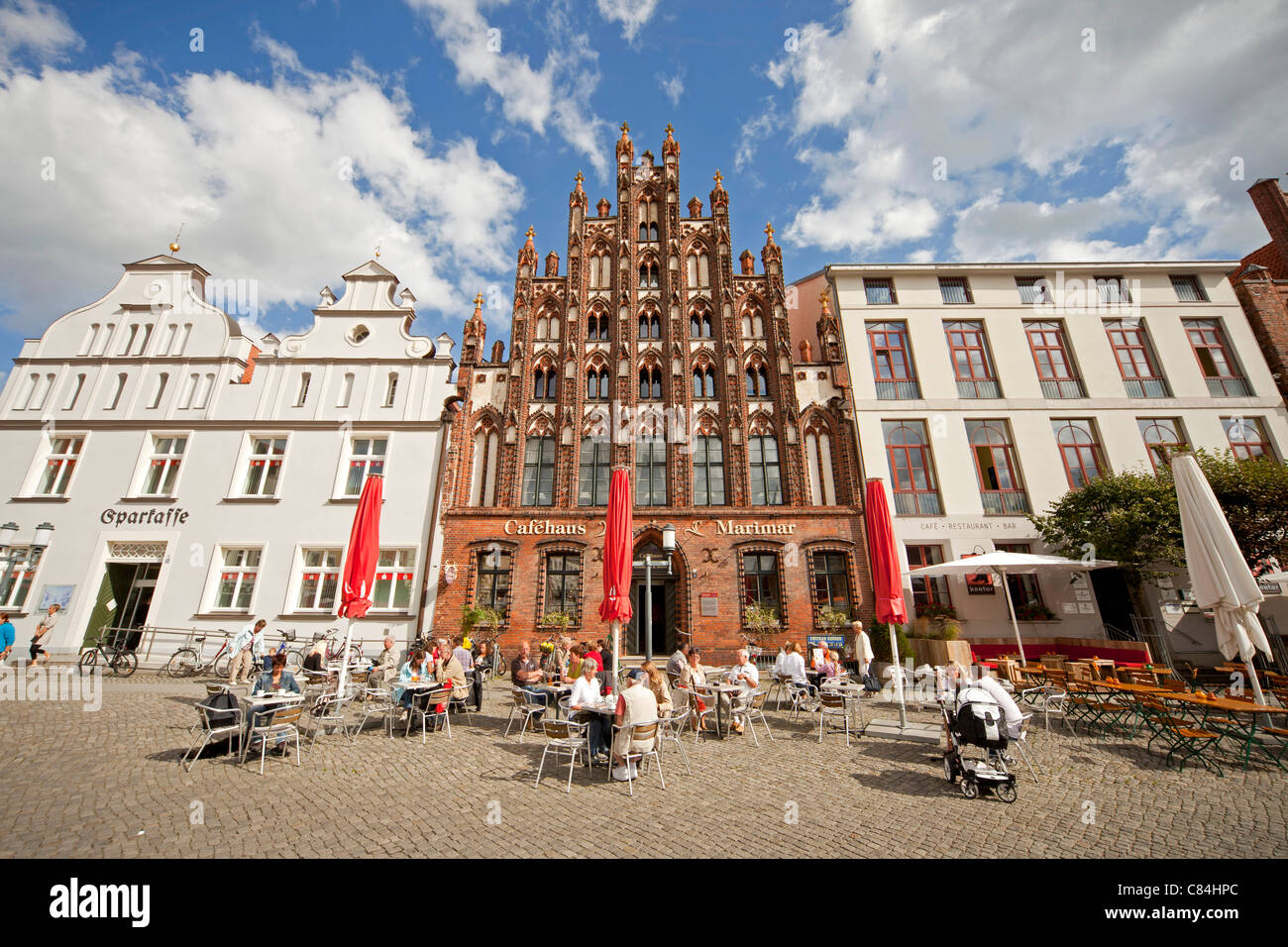 street cafe and typical buildings on the  market square of the Hanseatic City of Greifswald, Mecklenburg-Vorpommern, Germany Stock Photo