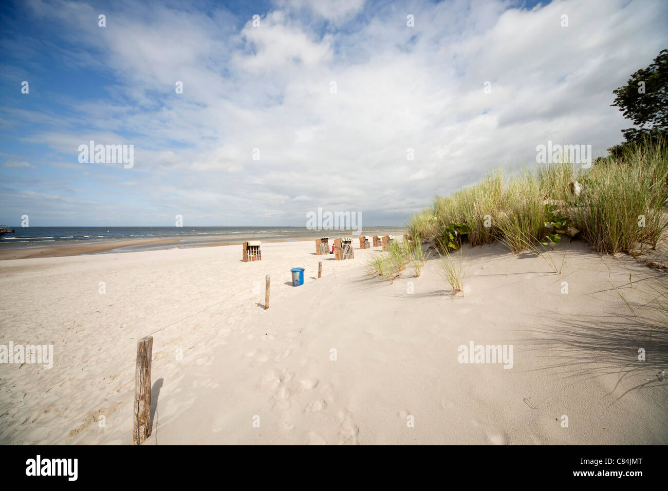 Beach chairs ' Strandkorb ' and the baltic beach of the coastal resort of Lubmin, Mecklenburg-Vorpommern, Germany Stock Photo