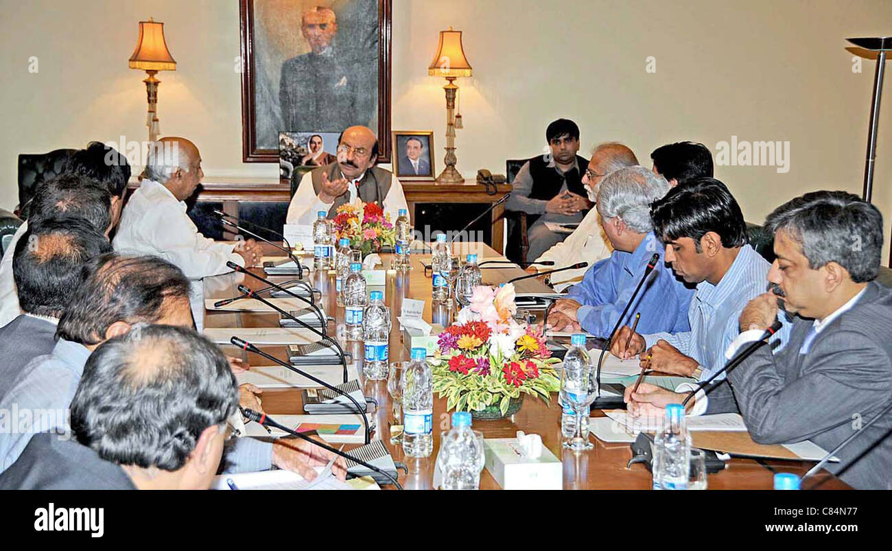 Sindh Chief Minister, Syed Qaim Ali Shah holds meeting to review arrangements for rain affected Sanghar district at CM House Stock Photo