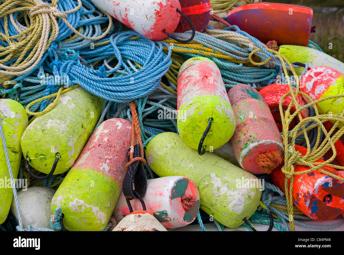 Collection of old buoys at a harbour Stock Photo