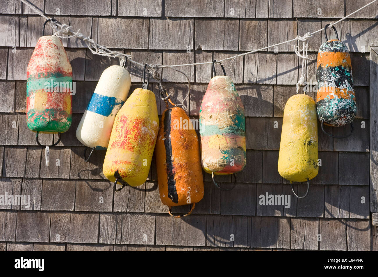 Old buoys on a exterior wall Stock Photo