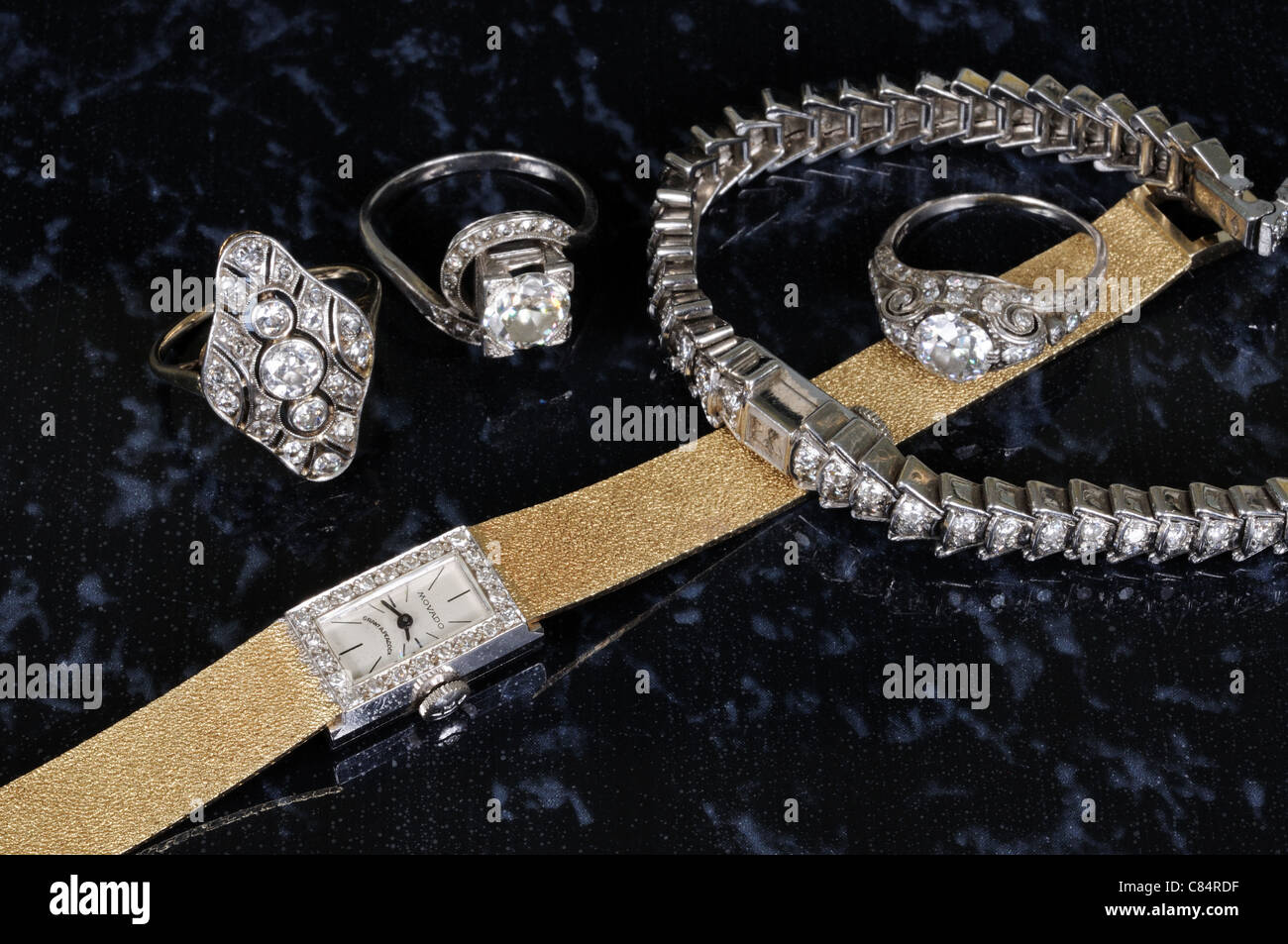 Gold Diamond and Platinum Wristwatches and Rings, England, UK, Great Britain, Western Europe. Stock Photo