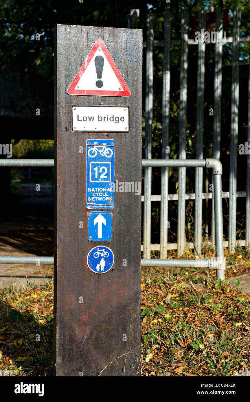 Low bridge and cycleway signs in Kent UK Stock Photo - Alamy