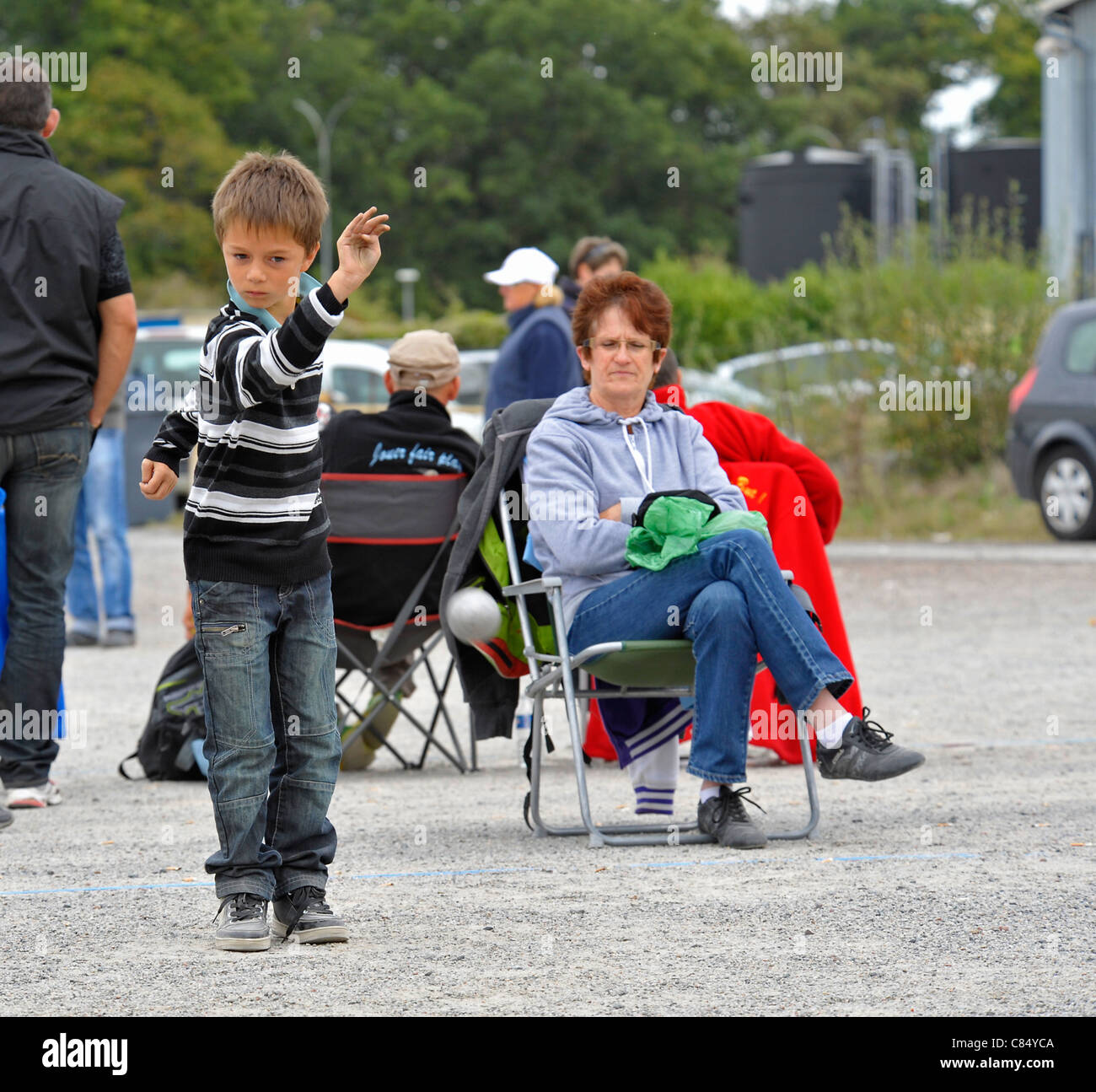Youngster Playing Petanque at Parthenay,Deux-Sevres,France. Stock Photo