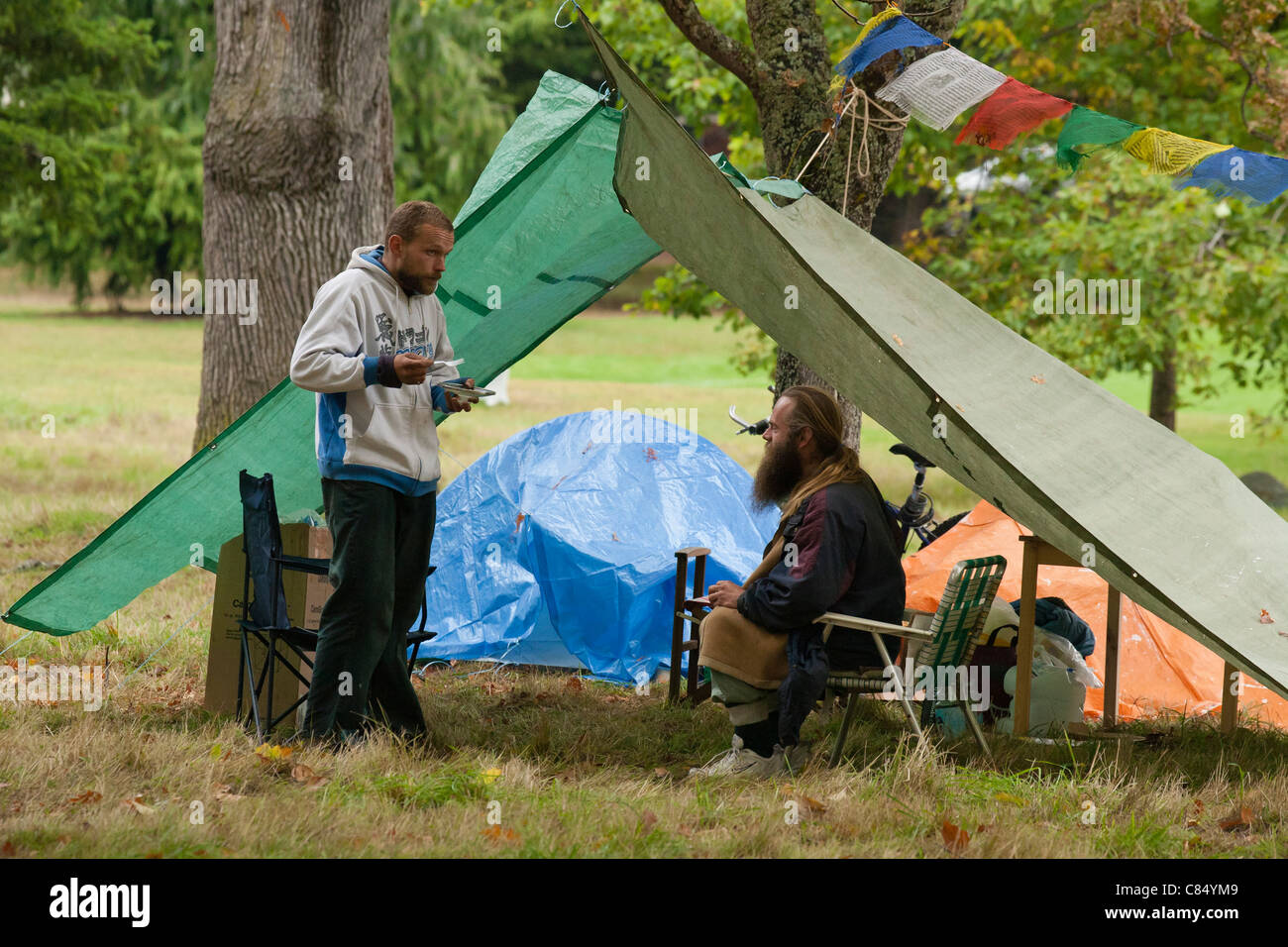 Homeless men camping in city park in autumnVictoria, British Columbia