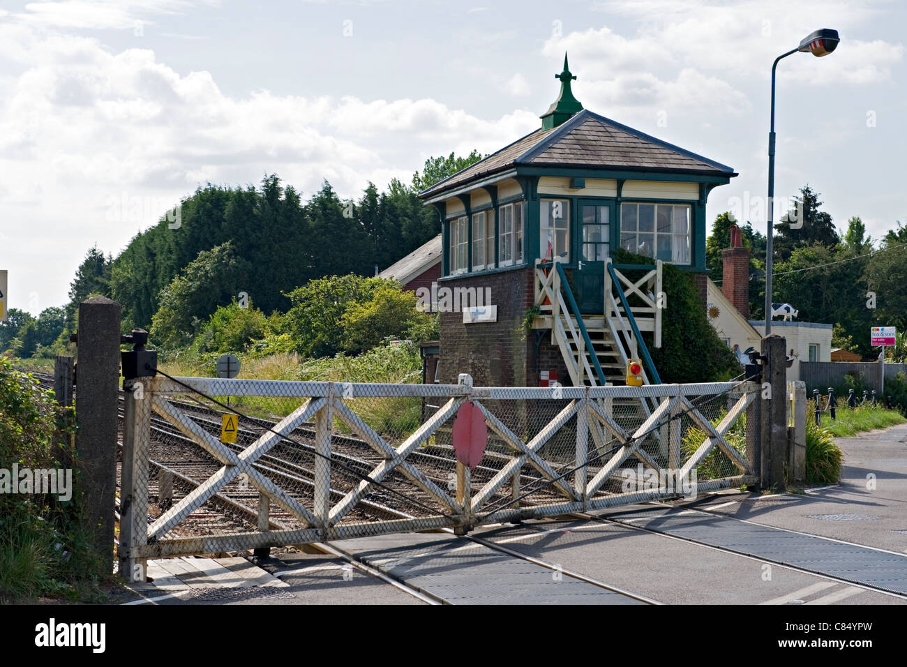 Railway crossing gates at Plumpton Railway yStation, UK Stock Photo