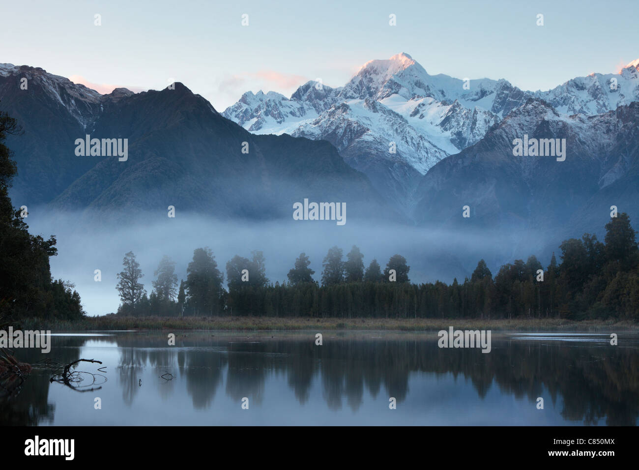 Reflection of Mt Cook (Aoraki) and Mt Tasman on Lake Matheson near Fox ...