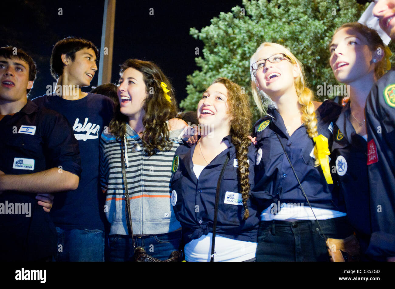 Hundreds of supporters gather around the Shalit family protest tent near the PM's residence to share relief and joy over the developing prisoners exchange that may bring the release of abducted IDF soldier Gilad Shalit. Jerusalem, Israel. 11/10/2011. Stock Photo