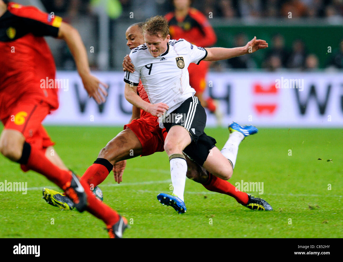 Qualification match for the European Football Championship in Poland and Ukraine 2012; Germany vs Belgium 3:1, at the Esprit Arena in Duesseldorf, Germany: Andre Schürrle, Schuerrle (Germany, Bayer Leverkusen) vs Vincent Kompany (Belgium, Manchester City). Stock Photo