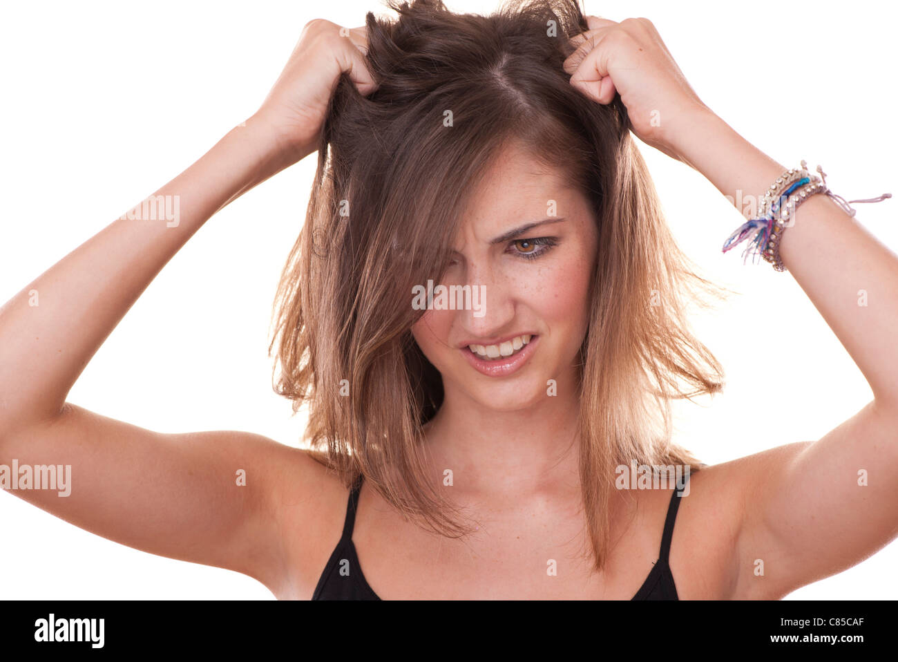 young woman stressed pulling her hair Stock Photo Alamy