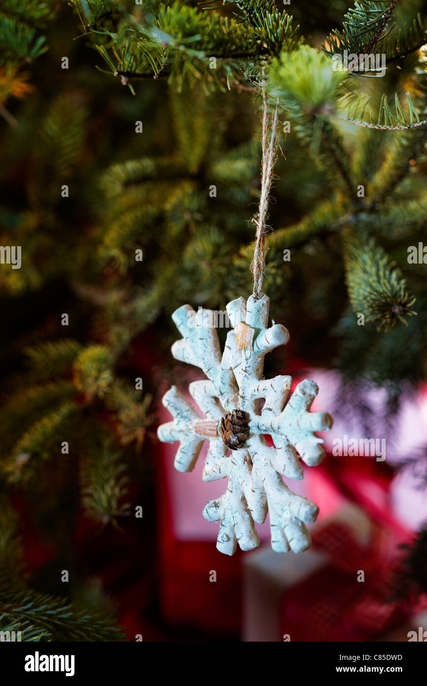 Snowflake Ornament on Christmas Tree Stock Photo