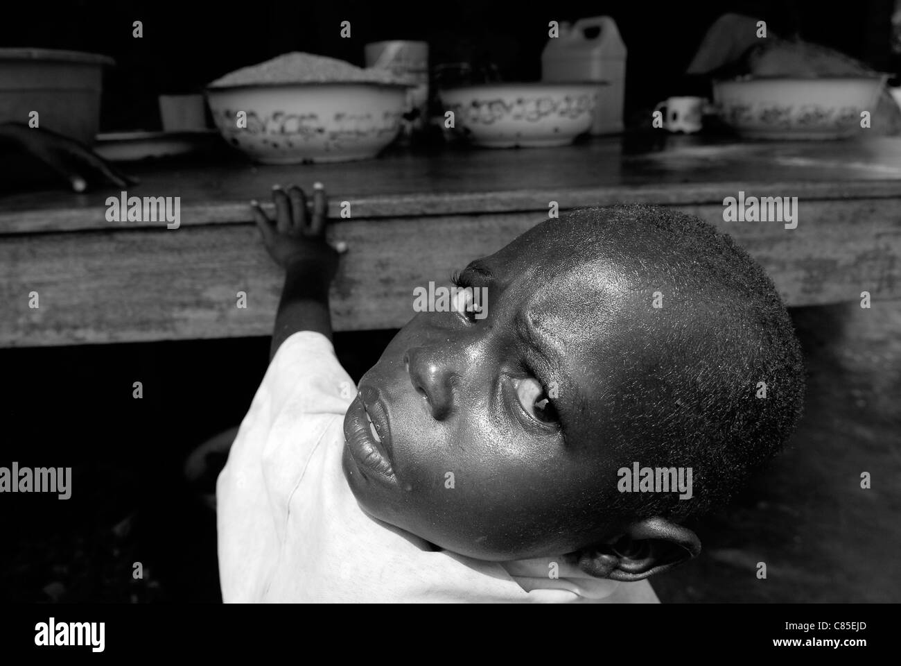 An internal displaced boy waiting for meal at a feeding center in North Kivu, Congo DR central Africa Stock Photo