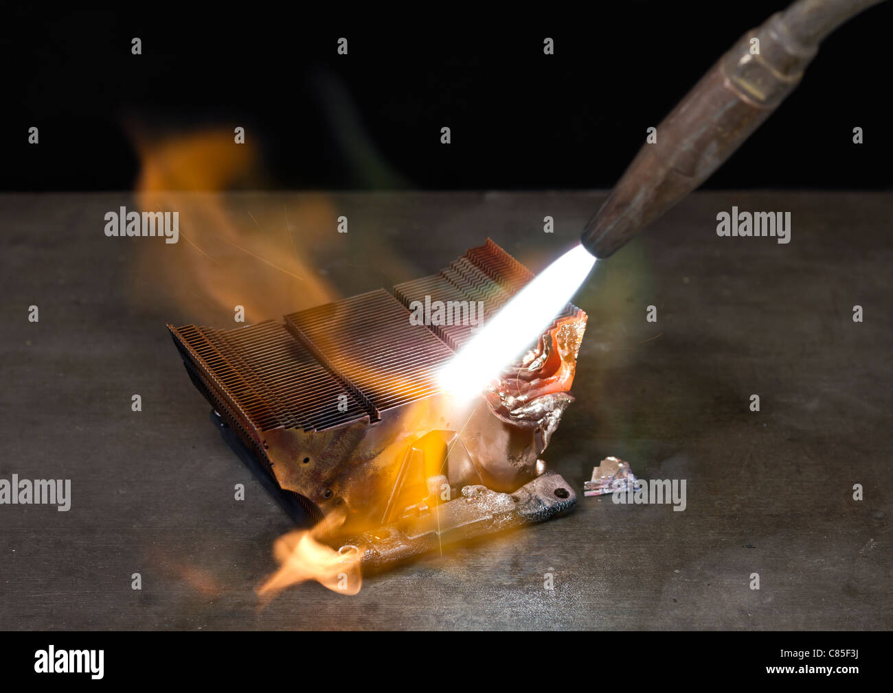 heating up a cooling element with a blowpipe Stock Photo Alamy