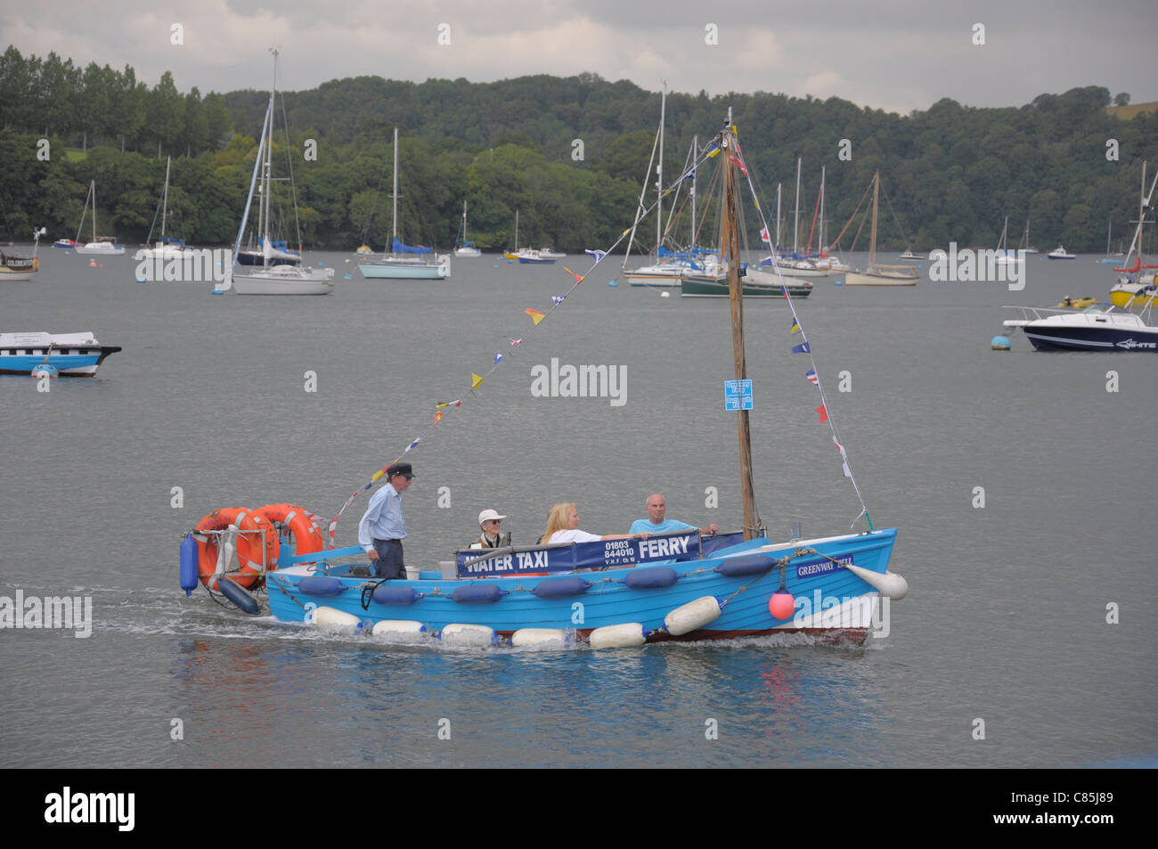 Water taxi ferry crossing the River Dart to Greenway near Dartmouth. Stock Photo
