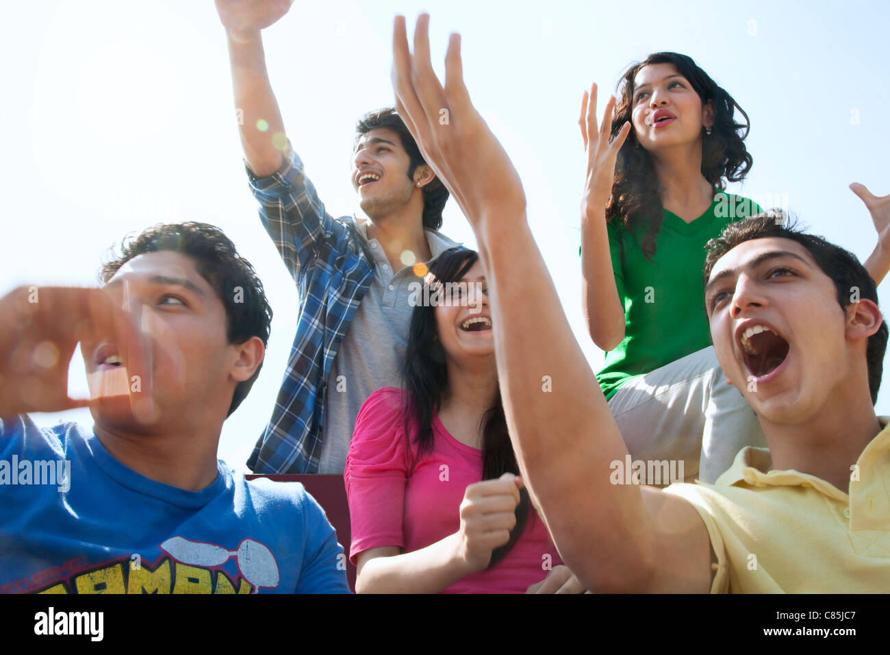 Youngsters cheering Stock Photo