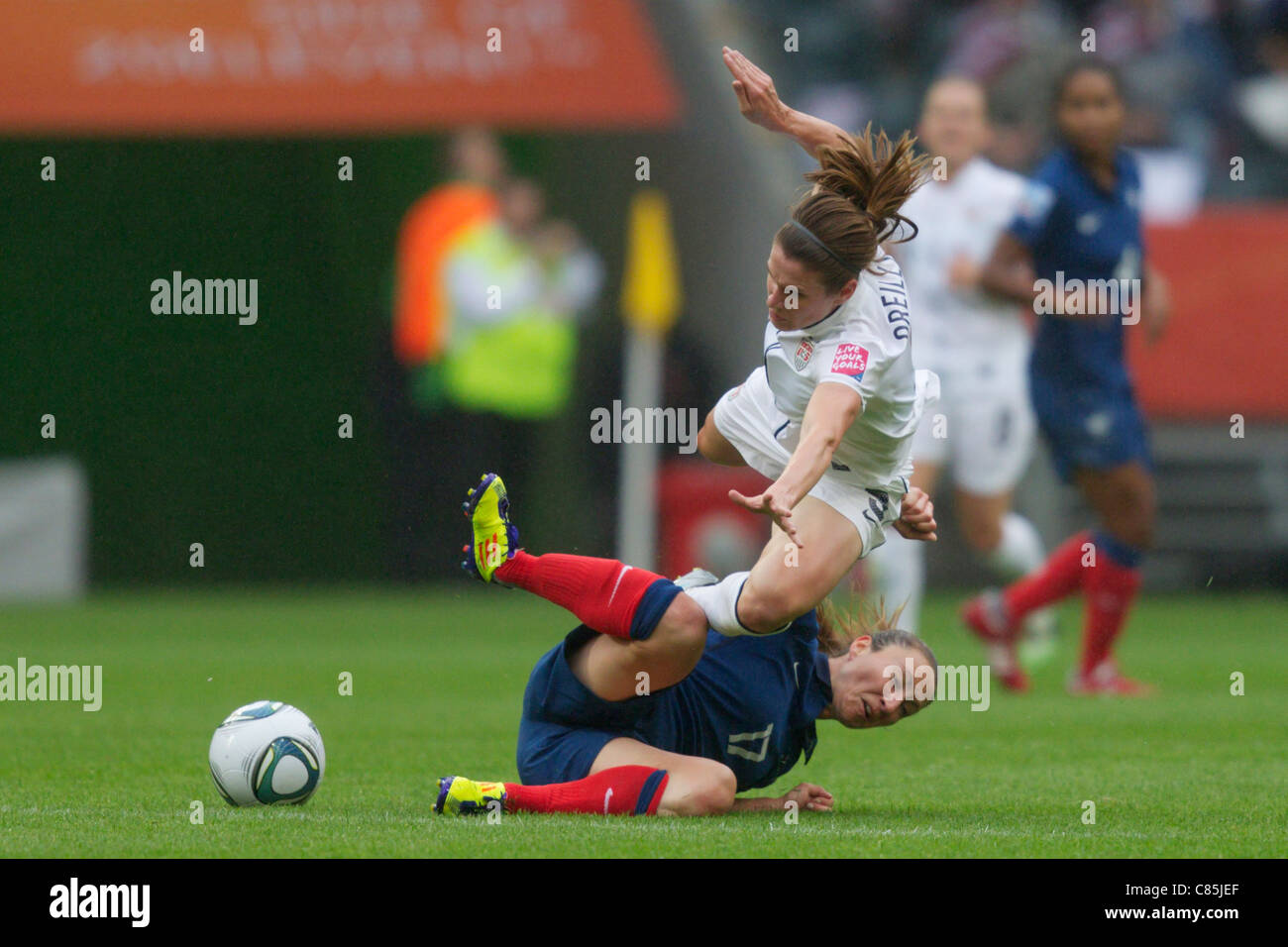 Gaetane Thiney of France (L) tackles Heather O'Reilly of the United States (R) during a 2011 Women's World Cup semifinal match. Stock Photo
