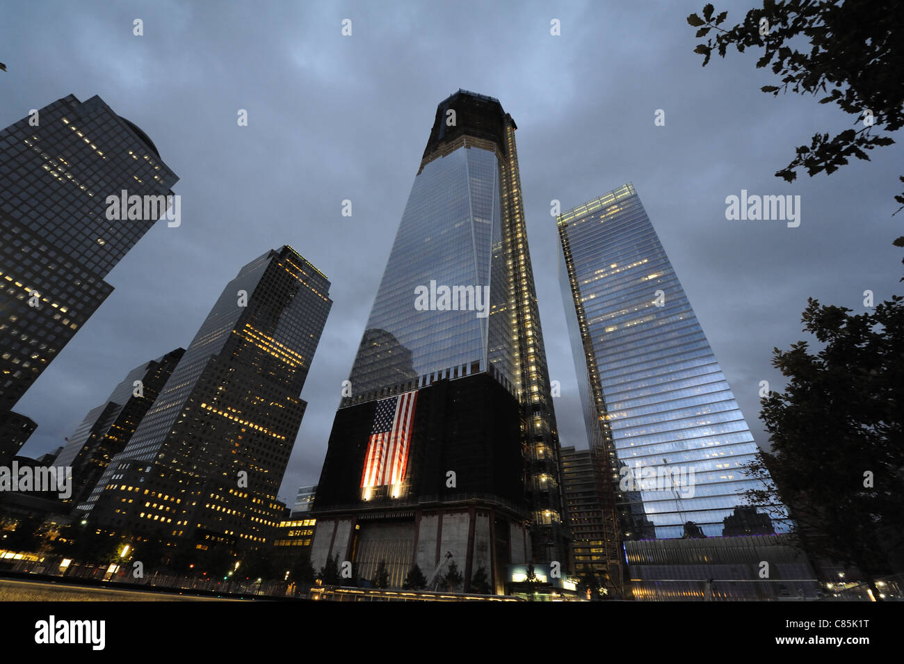 1 World Trade Center and 7 World Trade Center at night as seen from the plaza of the National September 11 Memorial. Stock Photo