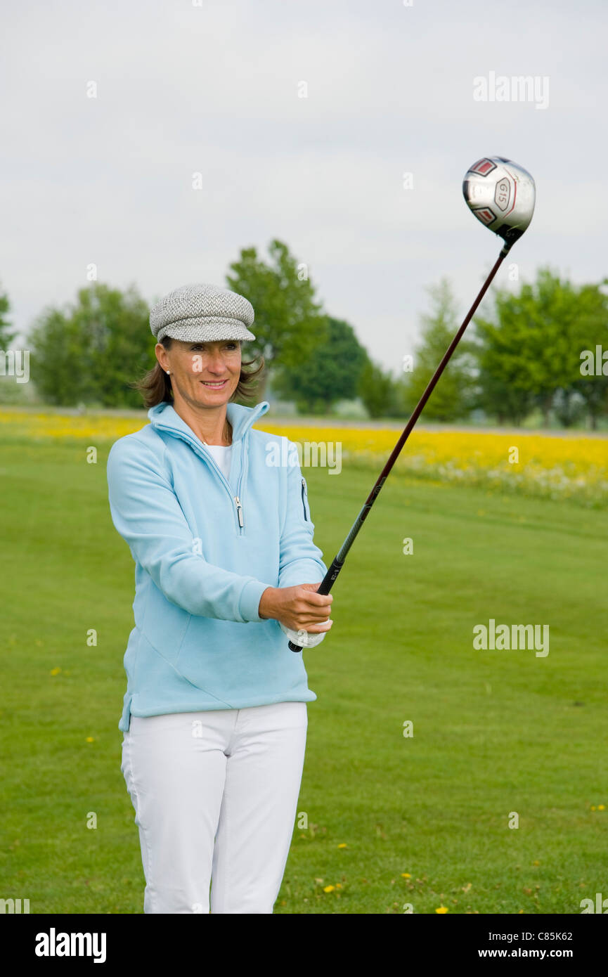 Woman Golfing, Berchtesgaden, Berchtesgadener Land, Oberbayern, Bavaria, Germany Stock Photo