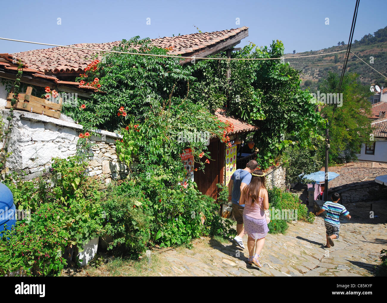 SIRINCE, TURKEY. View of a steep cobbled street in the rustic hillside village near Selcuk. 2011. Stock Photo