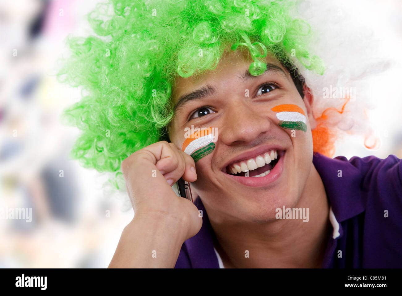 Boy with a wig talking on a mobile phone Stock Photo Alamy