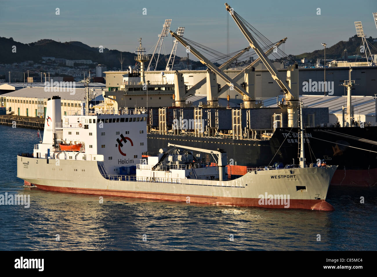 The Cement Carrier Westport Docking and Bulk Carrier TPC Samjin Docked at Wellington Harbour North Island New Zealand NZ Stock Photo