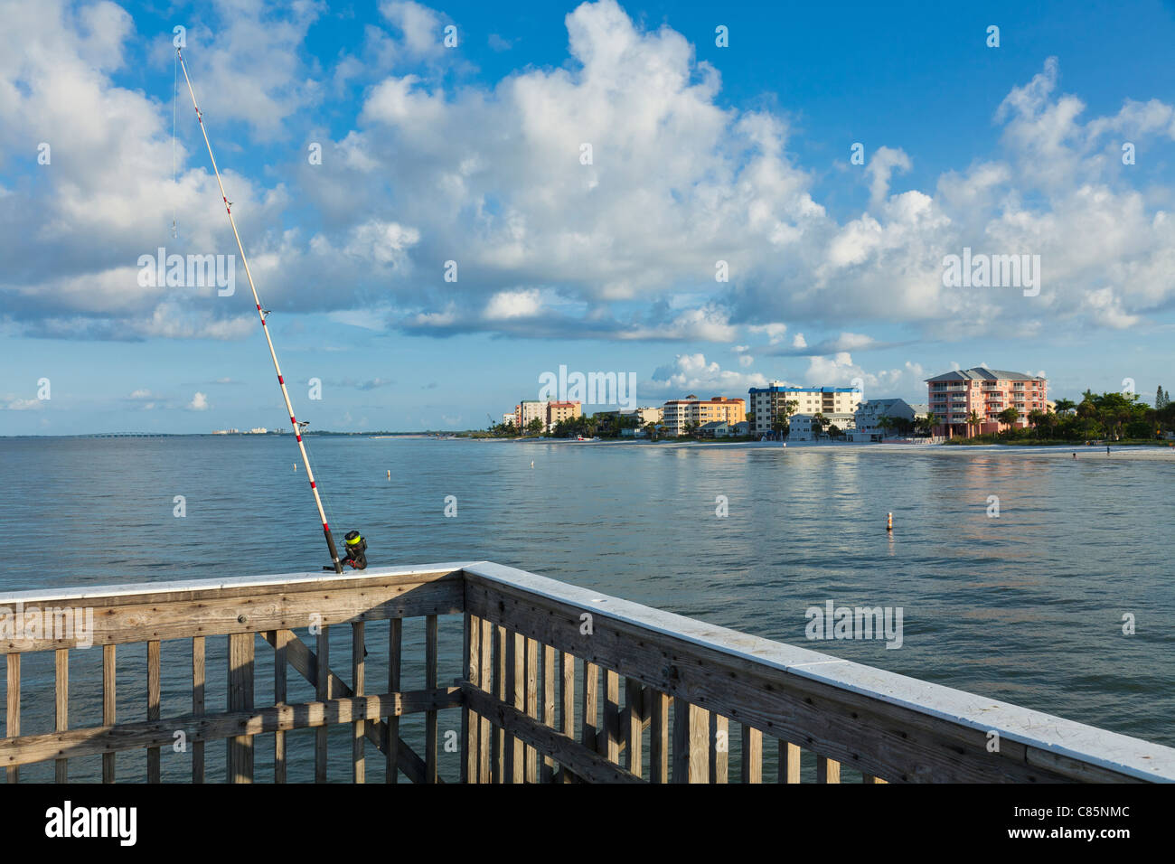 Fishing pole on railing of fishing pier, Fort Myers Beach, Florida, USA Stock Photo
