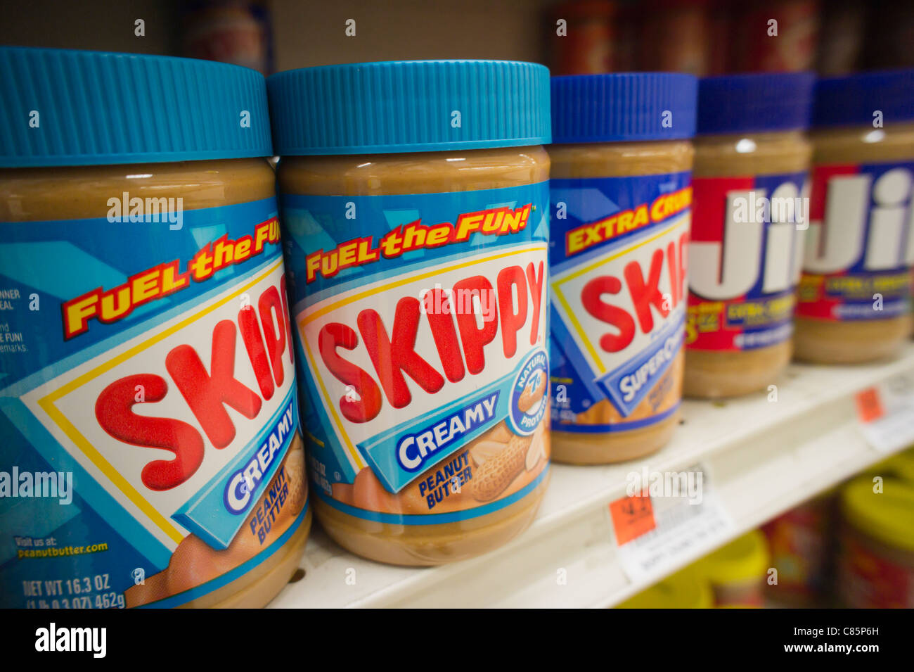 Jars of Skippy and Jif peanut butter are seen on a supermarket shelf in New York Stock Photo