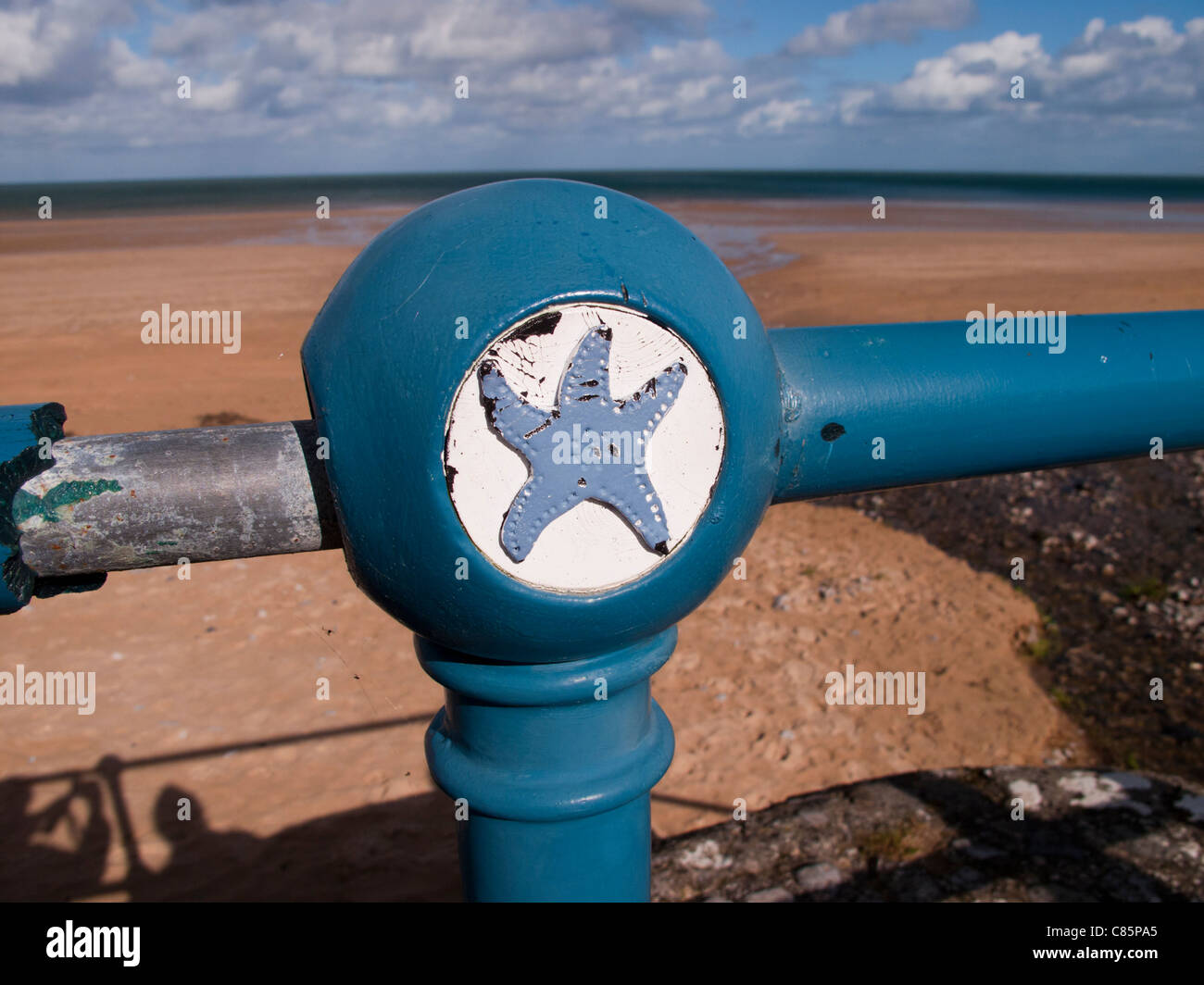 Benllech Bay, Anglesey Wales. Painted railings - Star fish Stock Photo