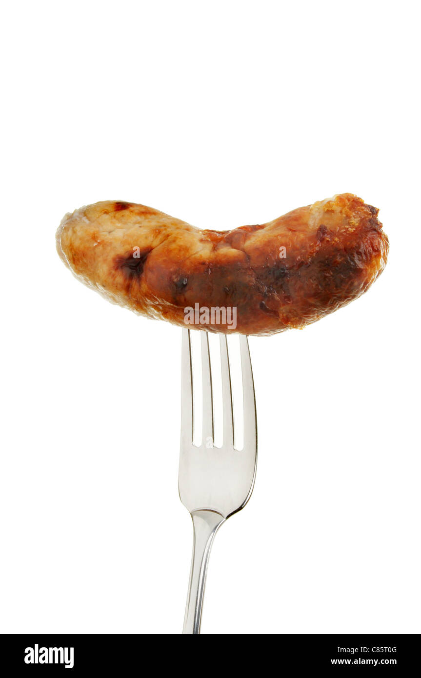 Closeup of a grilled sausage on a fork isolated against white Stock Photo